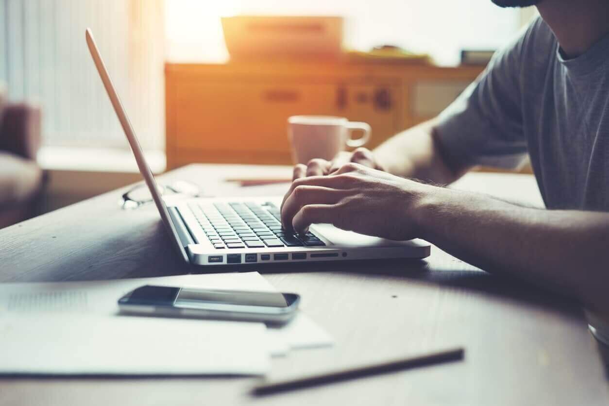 Man using laptop at his workplace